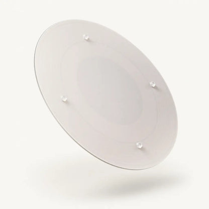 Alorivo tempered glass cutting board backside showing four anti-slip silicone feet, frosted glass texture, floating on warm white background with soft gradient shadow.