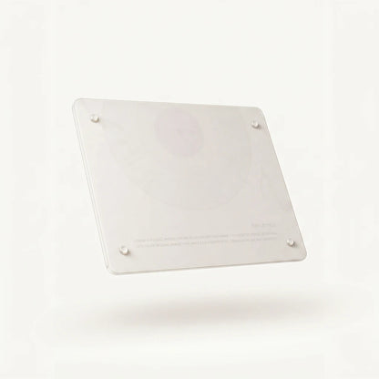 Reverse side of the Alorivo tempered glass cutting board showing transparent non-slip silicone feet and minimalist brand labeling.